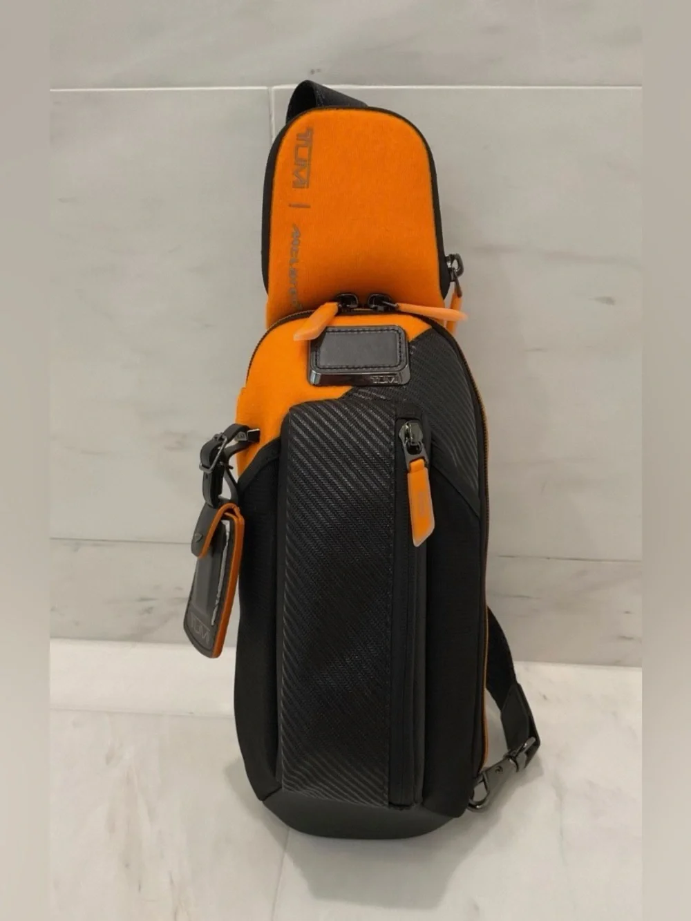 NEW Tumi McLaren Esports Downforce PRO Sling Crossbody - Black & Papaya Orange
